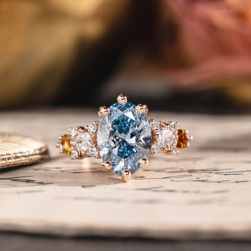 Oval fancy vivid blue lab-grown diamond engagement ring in 14K rose gold