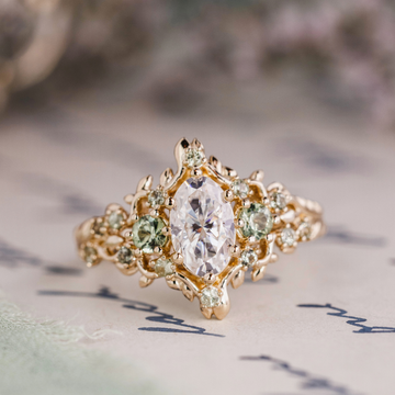 Custom Floral Vine Inspired Oval Moissanite Engagement Ring with Green Sapphire Accents