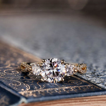 the-elodie-three-stone-round-diamond-engagement-ring-with-double-twist-accents