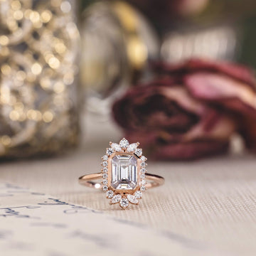the-hazel-emerald-cut-bezel-engagement-ring-with-diamond-halo
