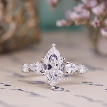 the-nightingale-marquise-diamond-engagement-ring-pear-shaped-diamond-accents