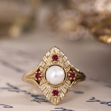 the-theodosia-victorian-inspired-pearl-engagement-ring-anthill-garnet-accents