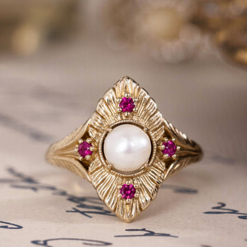 the-theodosia-victorian-inspired-pearl-engagement-ring-anthill-garnet-accents