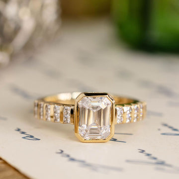 the-vivienne-emerald-cut-diamond-engagement-ring-bezel-setting-diamond-accented-band