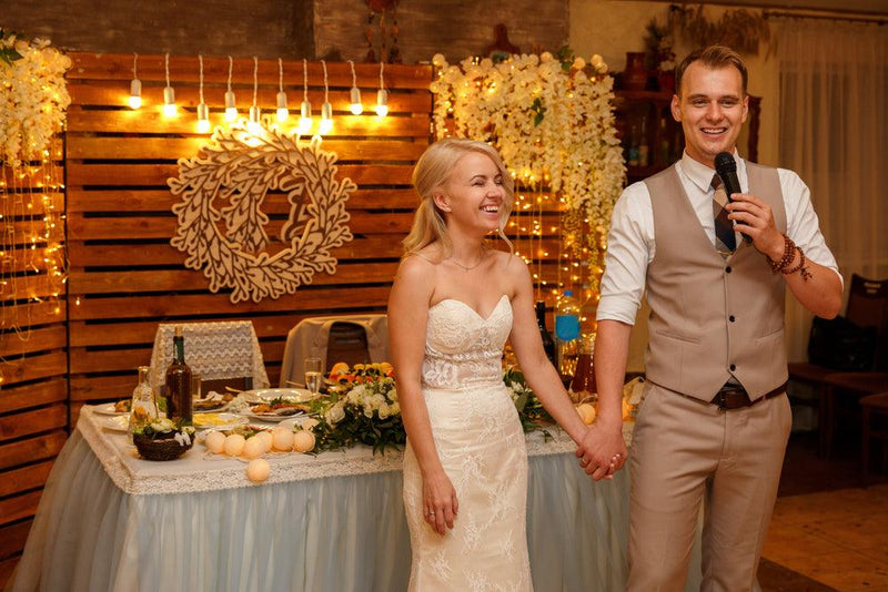 great groom speech holding hands of bride