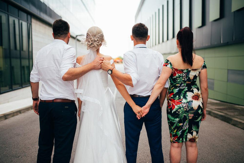 Bride and groom with best man and maid of honor