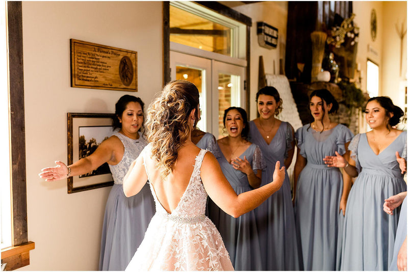bride talking with her bridesmaids and maid of honor
