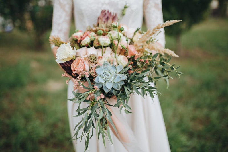 Bride holding bouquet of wedding flowers