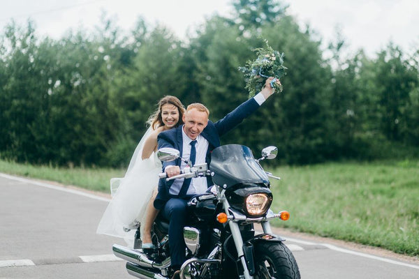 Couple eloping on a motorcycle
