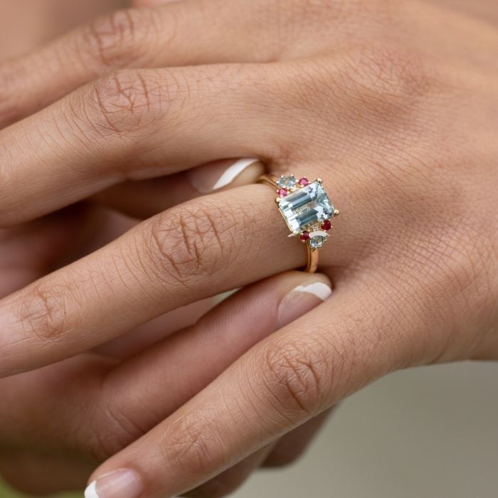 Woman-trying-on-Emerald-Cut-Aquamarine-Engagement-Ring