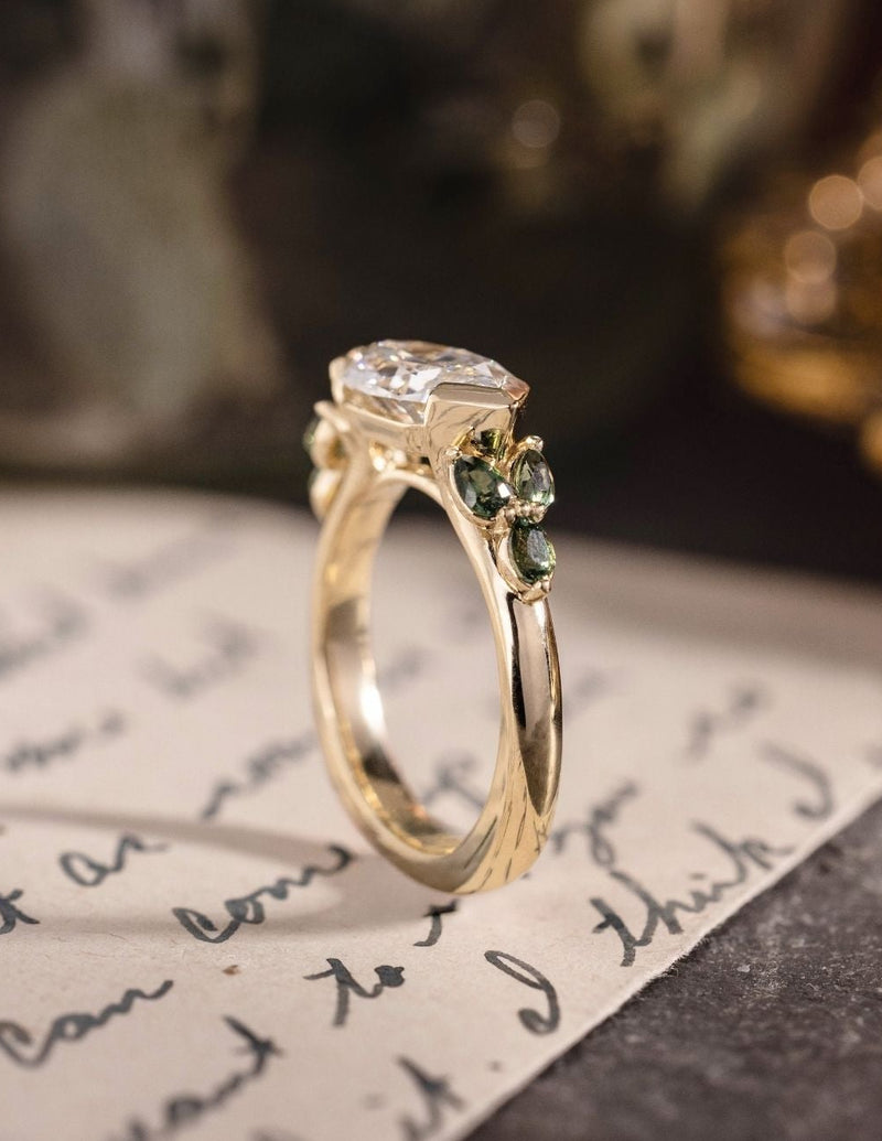 Dutch marquise diamond engagement ring with green sapphire accents in 10K yellow gold
