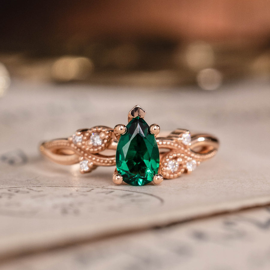 Pear cut lab-grown emerald engagement ring in 14K rose gold