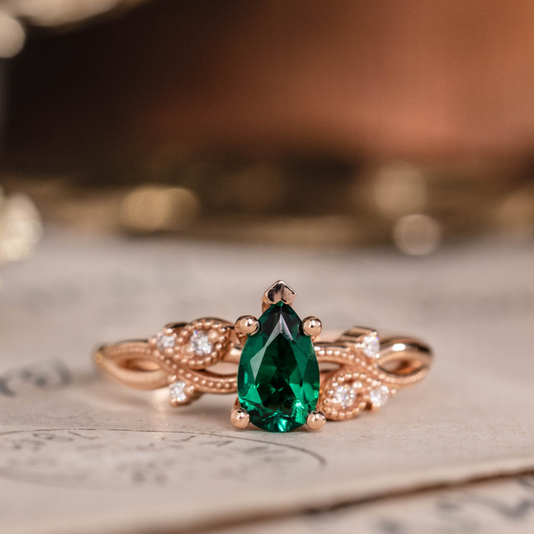 Pear cut lab-grown emerald engagement ring in 14K rose gold