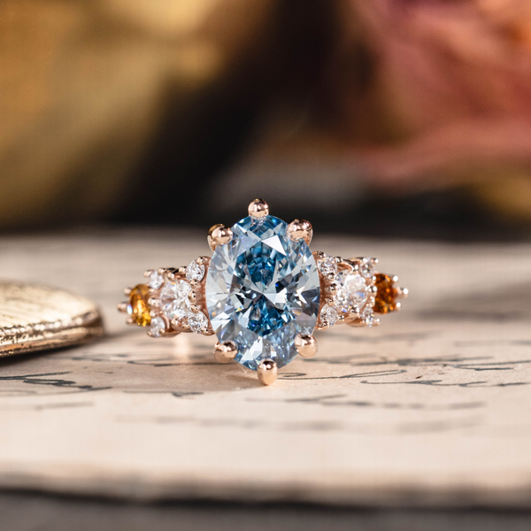 Oval fancy vivid blue lab-grown diamond engagement ring in 14K rose gold