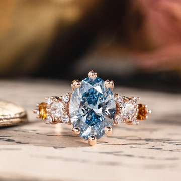 Oval fancy vivid blue lab-grown diamond engagement ring in 14K rose gold