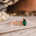 Pear cut lab-grown emerald engagement ring in 14K rose gold