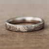    Apollo-faceted-hammered-titanium-mens-wedding-band-4mm