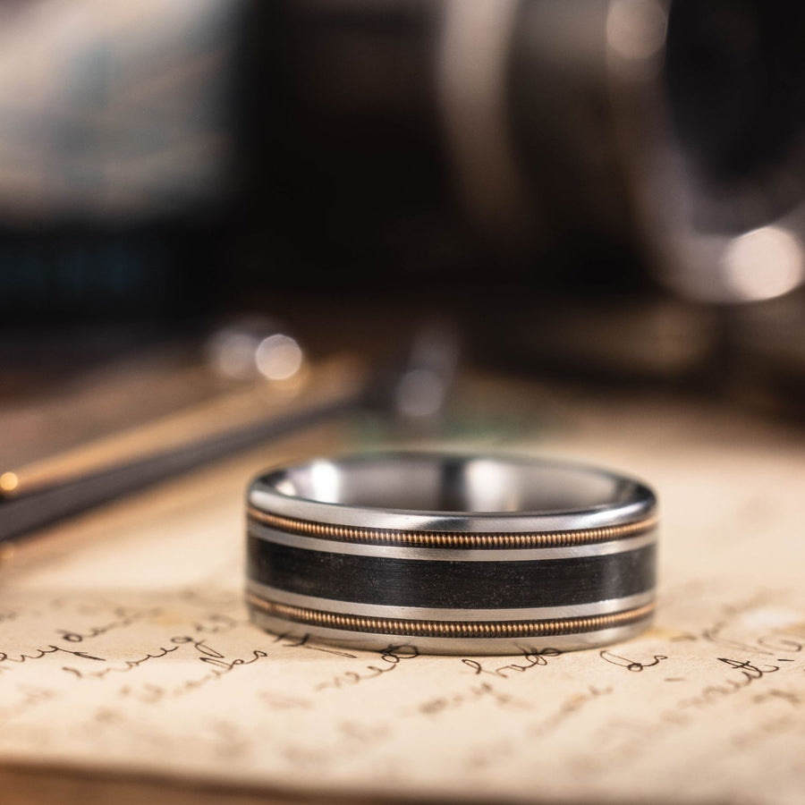 Bourbon-blues-brass-guitar-string-weathered-whiskey-barrel-mens-titanium-wedding-band