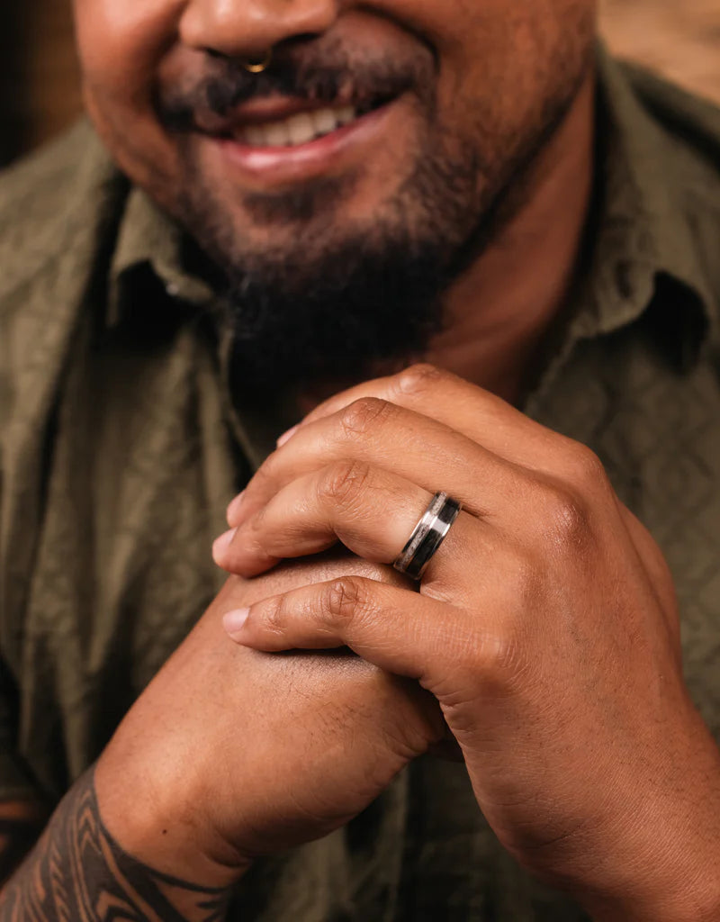 Man smiling wearing gent's weekend wedding band