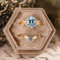 Custom oval aquamarine engagement ring with matching contour band and citrine stones