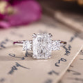Custom white gold cushion cut three stone diamond engagement ring