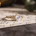 Custom Moissanite round engagement ring with floral accents