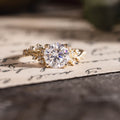 Custom Moissanite round engagement ring with floral accents