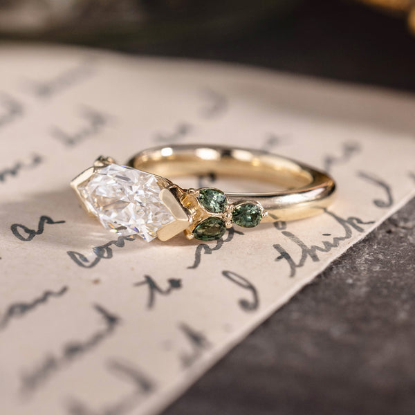 Custom east-west dutch marquise with green sapphire side stones