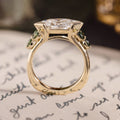 Custom east-west dutch marquise with green sapphire side stones