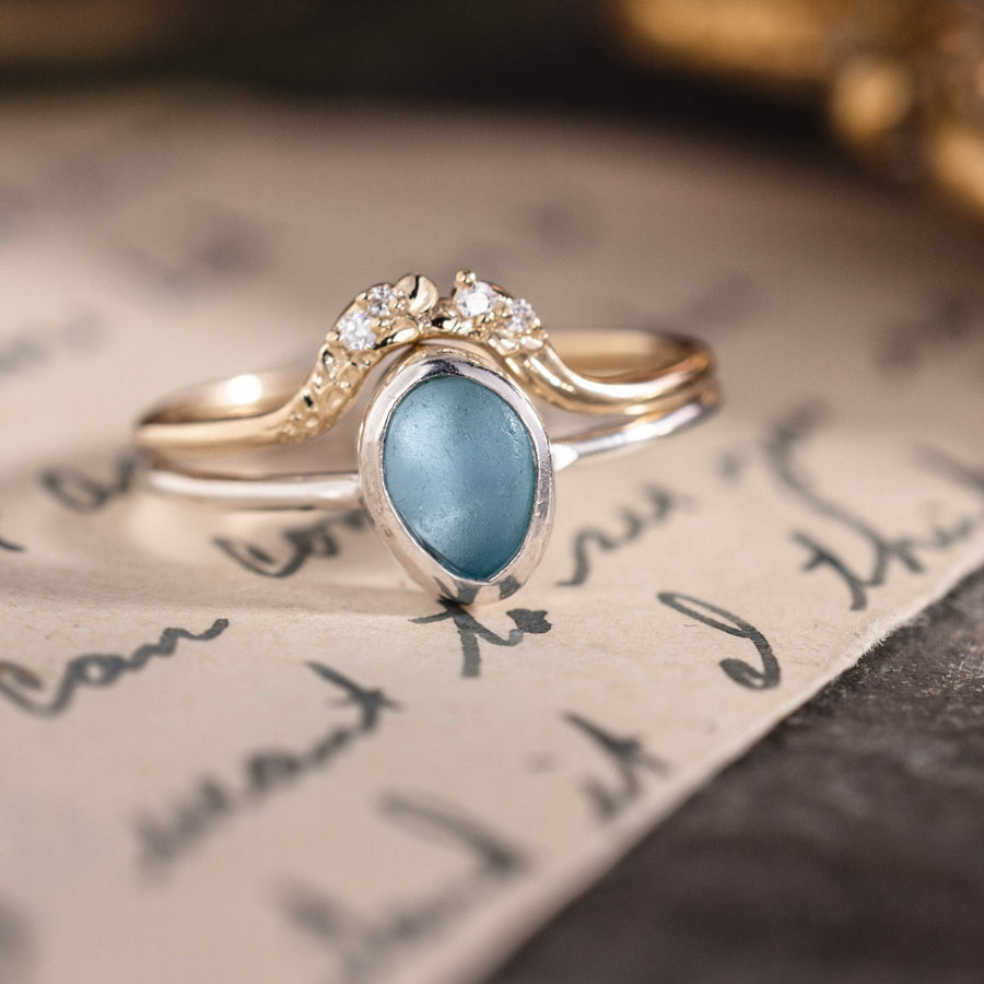 Custom floral contour band with diamonds and sea glass engagement ring