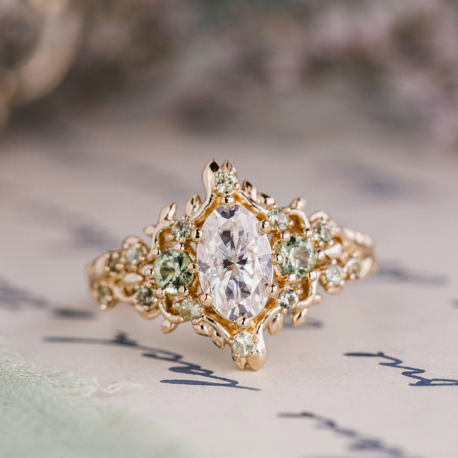 Custom Floral Vine Inspired Oval Moissanite Engagement Ring with Green Sapphire Accents