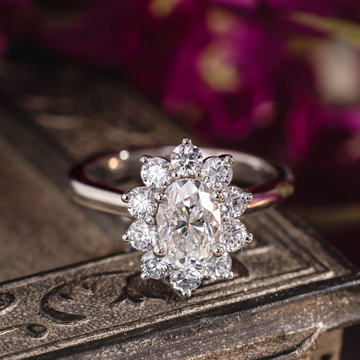 Custom platinum diamond ring with floral style halo