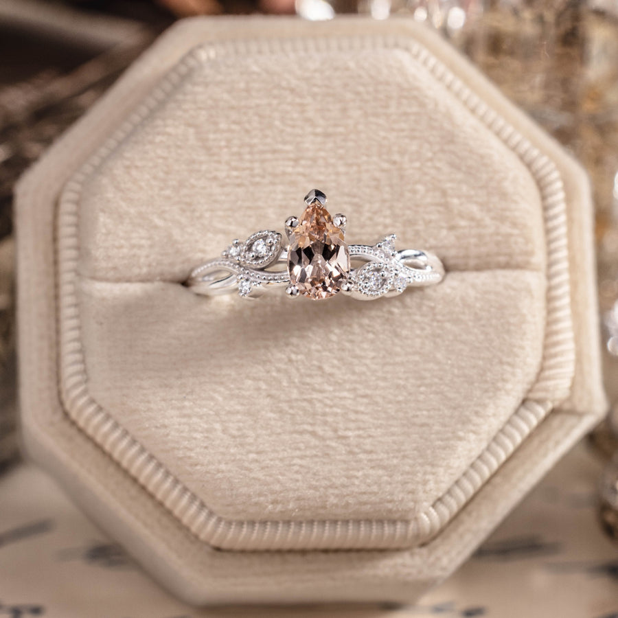White gold engagement ring with peach morganite