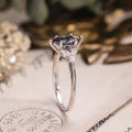 Marquise lab-grown alexandrite engagement ring in 10K white gold with diamond accents