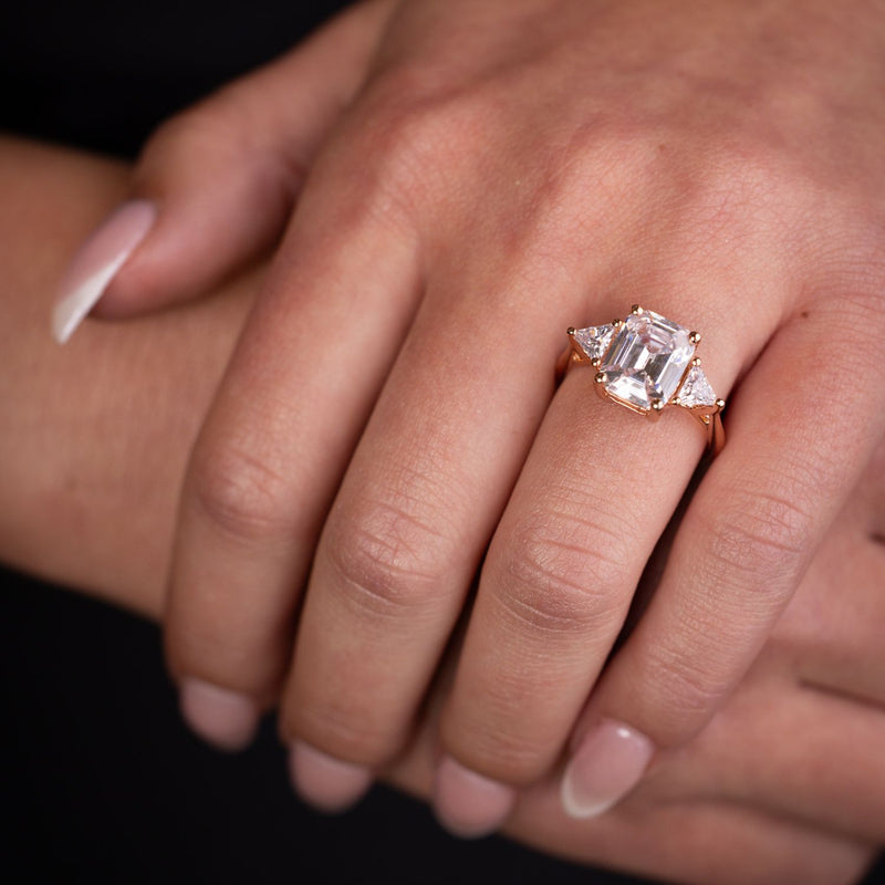 Emerald-cut-diamond-three-stone-engagement-ring-trillion-diamond-accent-stones-the-ingrid-rustic-and-main