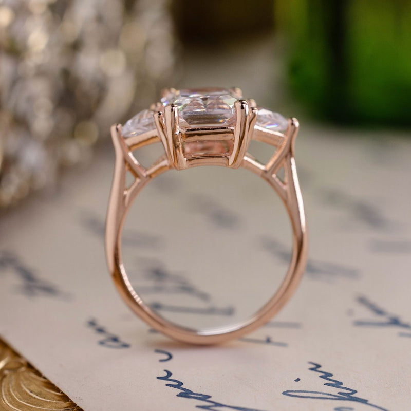 Emerald-cut-diamond-three-stone-engagement-ring-trillion-diamond-accent-stones-the-ingrid-rustic-and-main