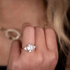 Emerald-cut-diamond-three-stone-engagement-ring-trillion-diamond-accent-stones-the-ingrid-rustic-and-main