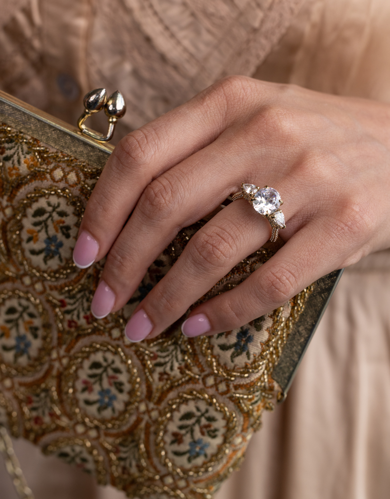 Oval & Pear Three-Stone with Hidden Halo