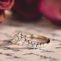 Contour wedding band with marquise, pear, and round diamond accents in 10K yellow gold