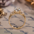 Oval diamond three-stone engagement ring with pear accents in 14K yellow gol