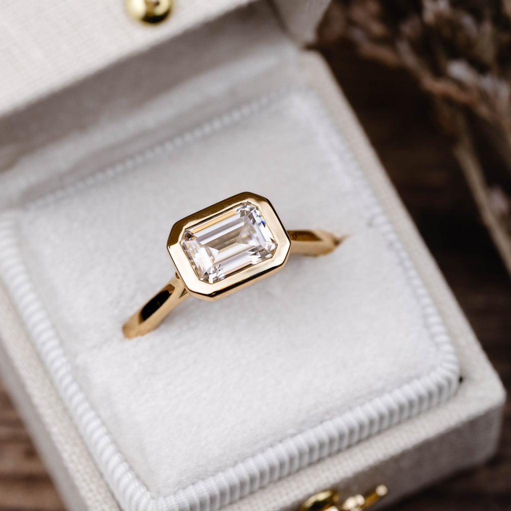 the-adeline-hidden-halo-emerald-cut-mossanite-engagement-ring-bezel-setting_28