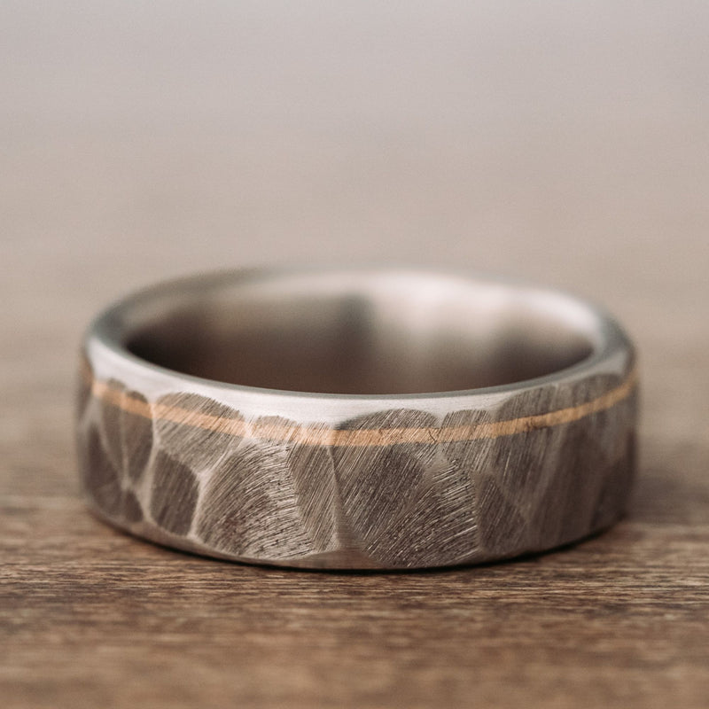 apollo-faceted-hammered-titanium-mens-wedding-band-offset-brass-inlay
