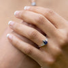 blue-sapphire-pear-cut-three-stone-engagement-ring-with-diamond-accents