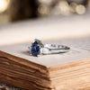 blue-sapphire-pear-cut-three-stone-engagement-ring-with-diamond-accents_10