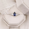 blue-sapphire-pear-cut-three-stone-engagement-ring-with-diamond-accents_10