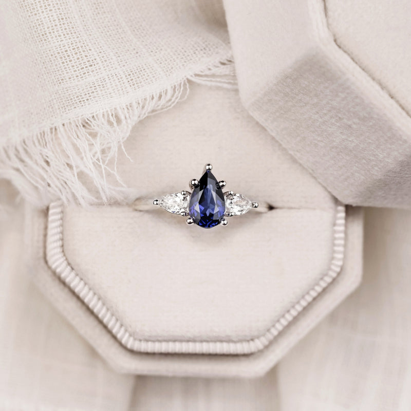 blue-sapphire-pear-cut-three-stone-engagement-ring-with-diamond-accents_10