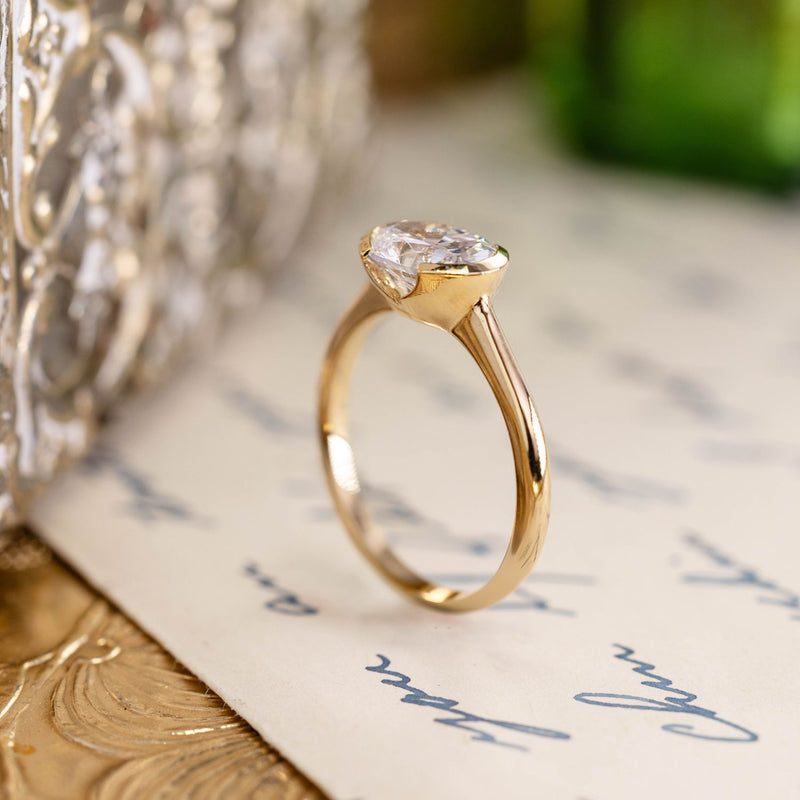 east-west-oval-diamond-solitaire-engagement-ring-bezel-setting-the-soren-rustic-and-main