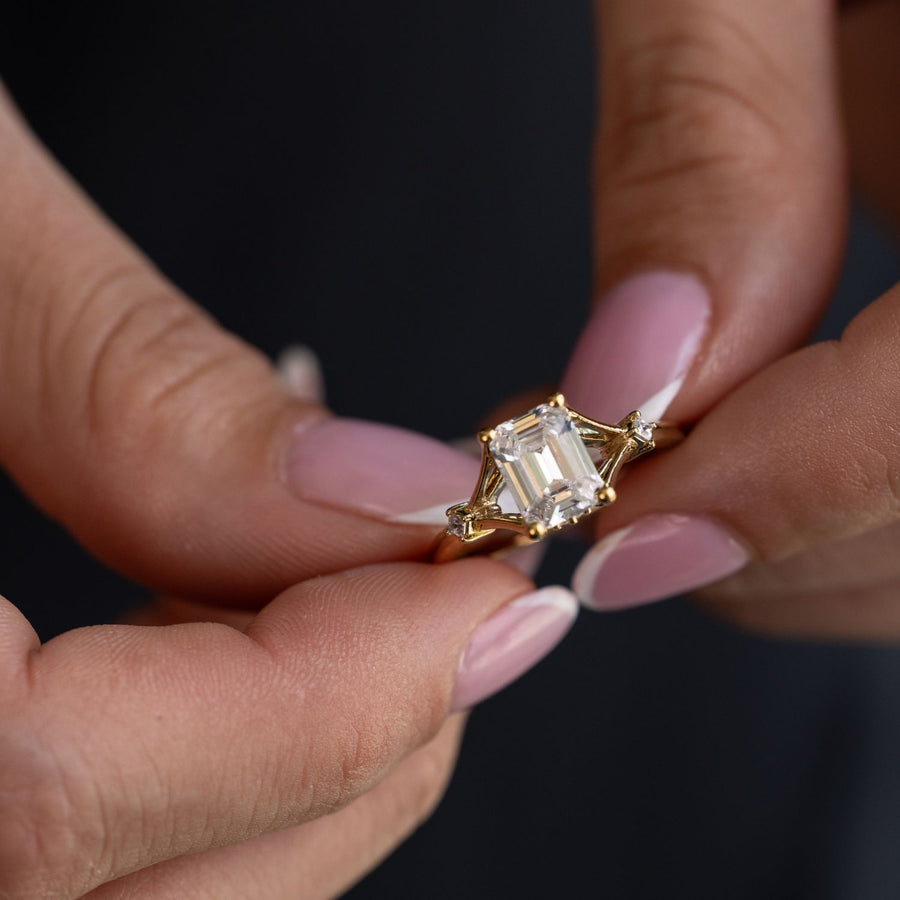 Emerald Cut Diamond Engagement Ring with Split Shank and Diamond Accents