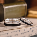 The Frontiersman & The Helen -  Black Whiskey Barrel and Titanium Wedding Band Set