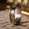in-stock-the-fairbanks-mens-titanium-wedding-band-with-green-imperial-diopside-gold-flakes-offset-inlay-size-10-5-7mm-wide